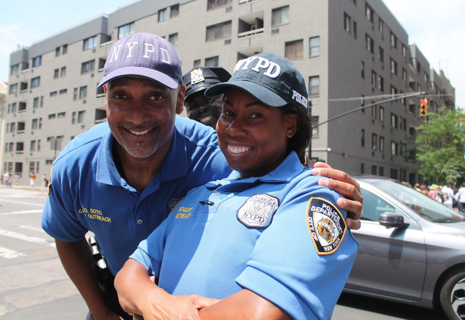 Two New York City Police Officers do community outreach on a sunny summer day