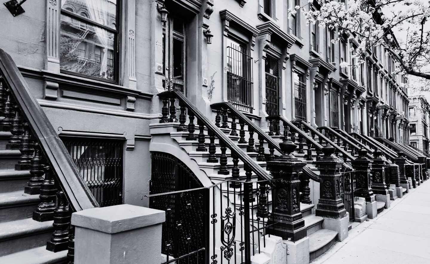 brownstones in nyc in black and white